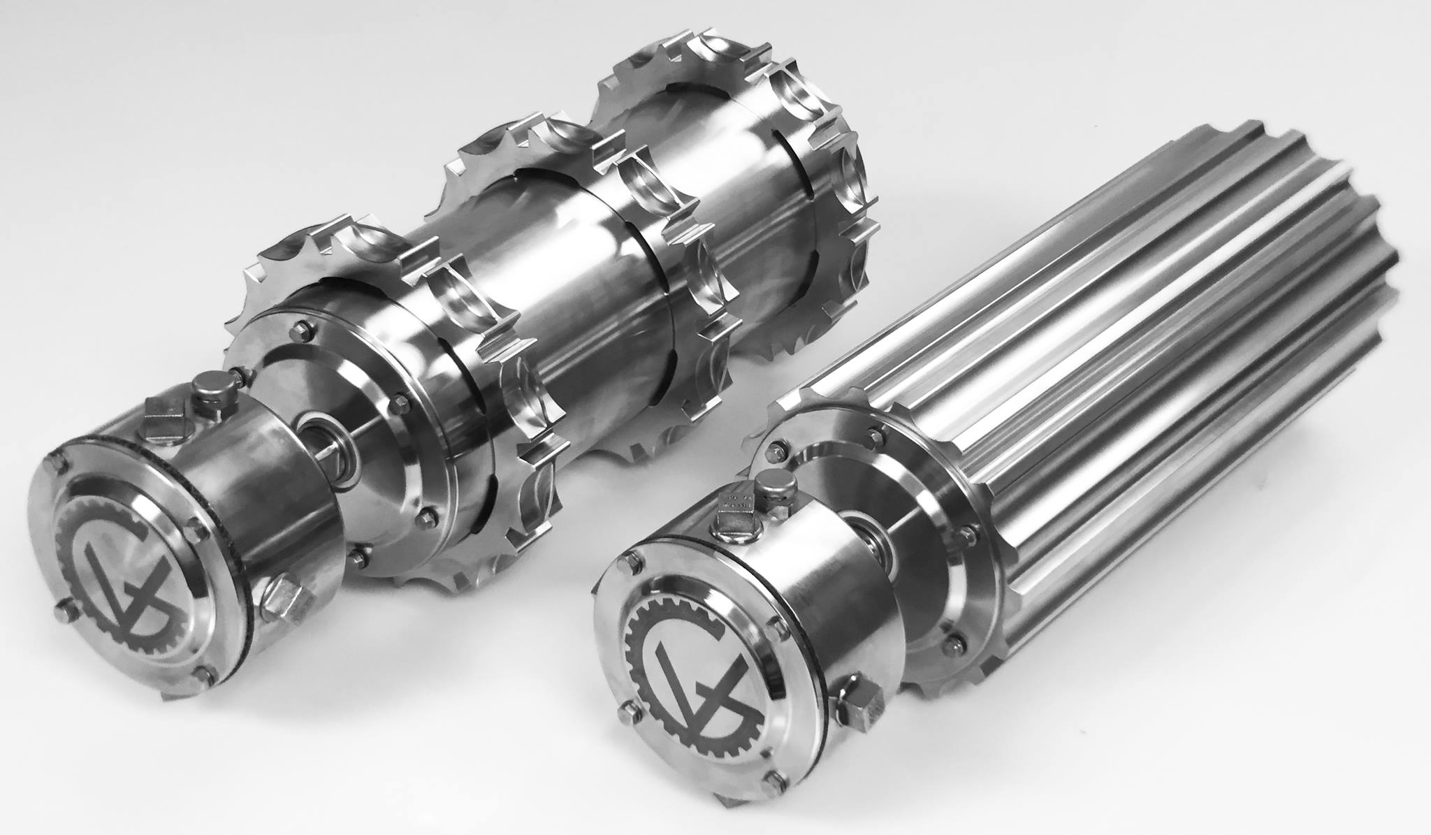 Motorized drum with stainless steel sprocket or machined shell for modular belts